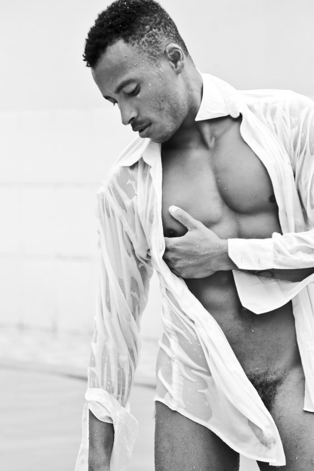 Hung model Deivid Barretto shows off in a teasing wet shirt shoot