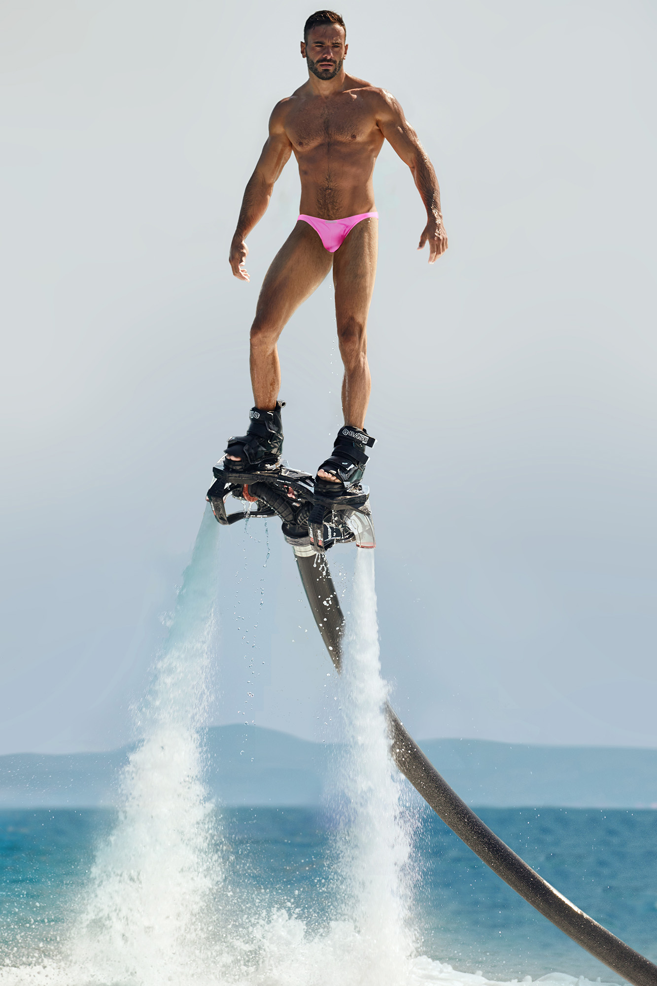 Handsome Denis Mastorakis in snug pink Modus Vivendi swimwear