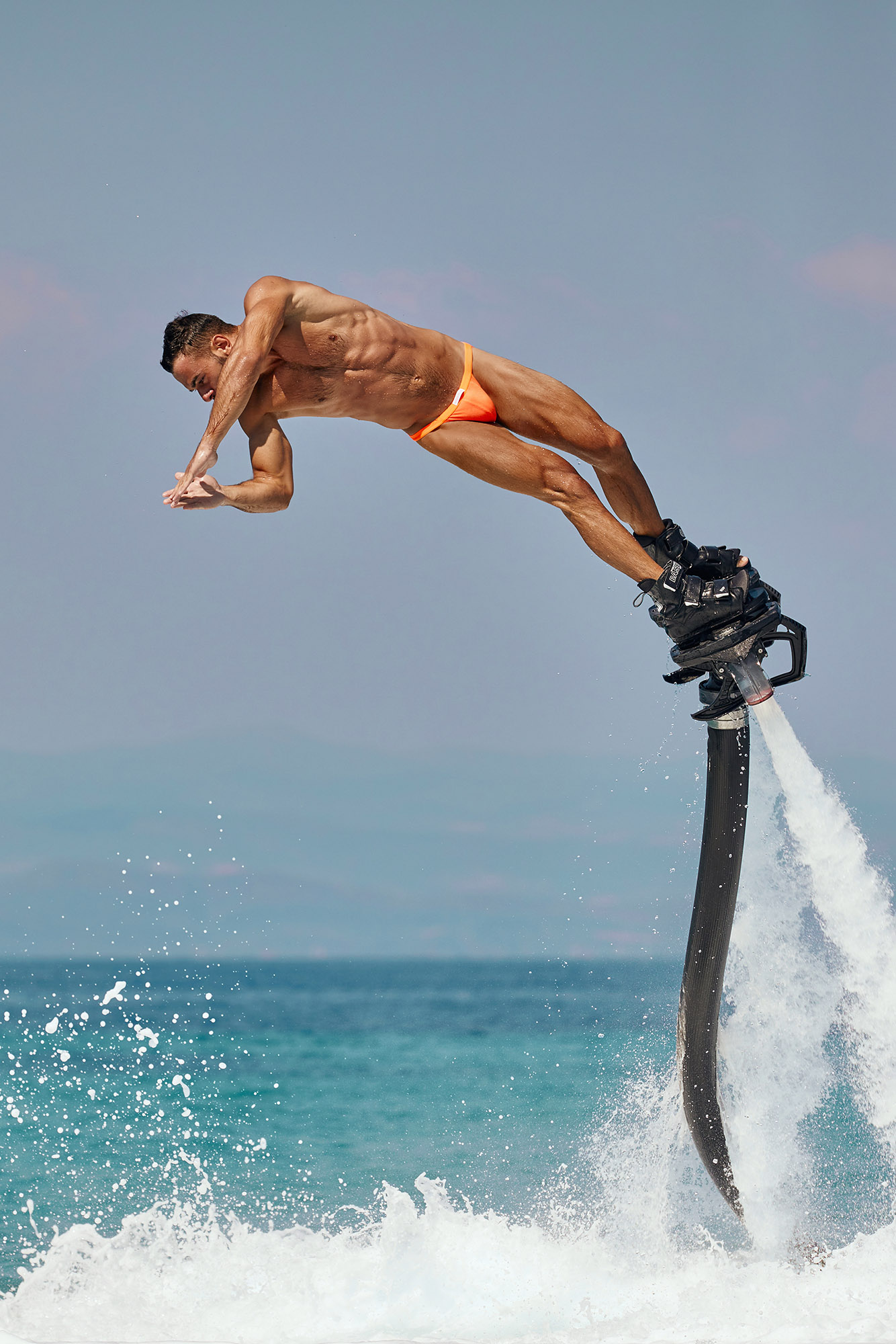 Gorgeous Greek model Denis Mastorakis performs an acrobatic dive