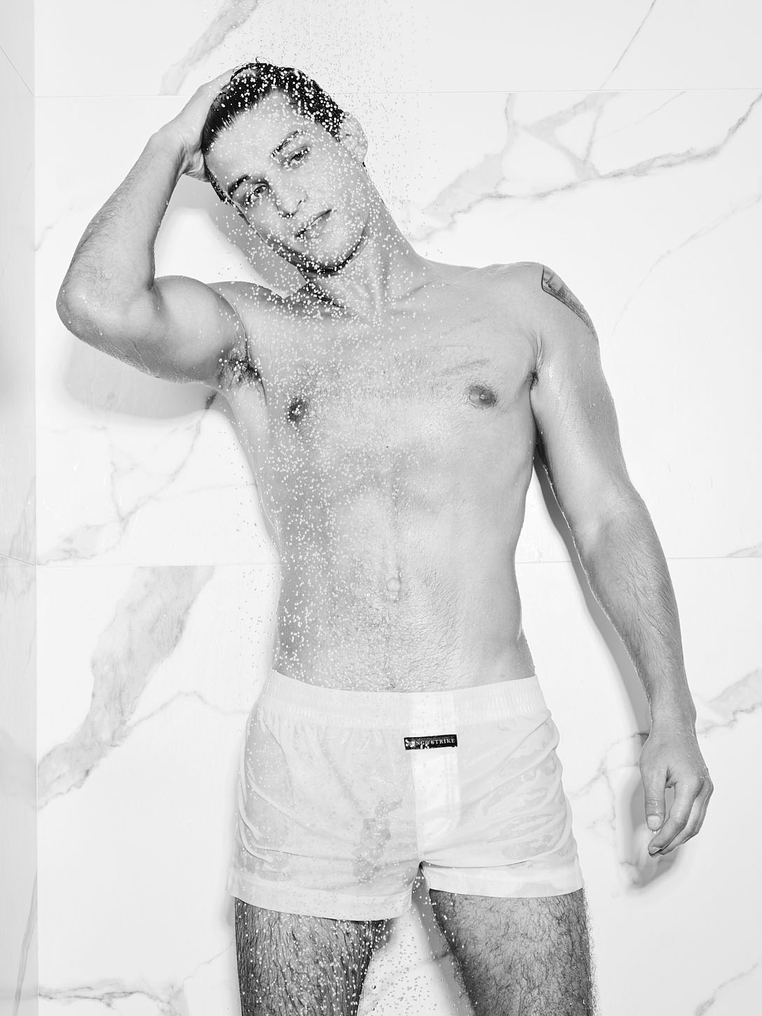 model Elliot Finn showing his cock in white wet boxer shorts